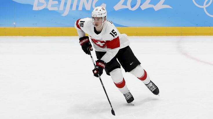 BEIJING, CHINA - FEBRUARY 09: Gregory	 Hofmann of Switzerland in action during the Men's Preliminary Round Group B match between ROC and Switzerland on Day 5 of the Beijing 2022 Winter Olympic Games at National Indoor Stadium on February 09, 2022 in Beijing, China. (Photo by Jean Catuffe/Getty Images)