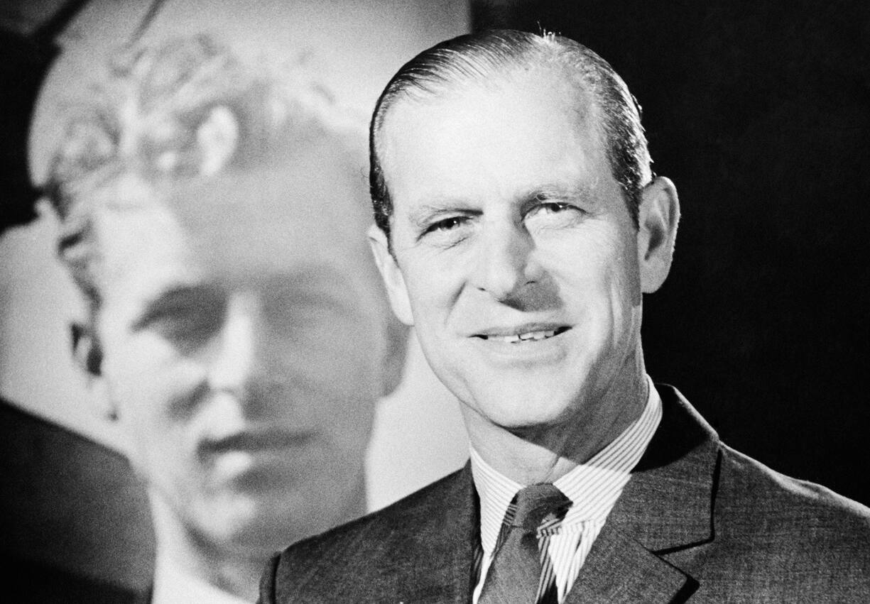 Prince Philip, Duke Of Edinburgh Dies at the Age of 99 announced on April 9,2021. Prince Philip, Duke of Edinburgh, with a photograph of his younger self, circa 1975. (Photo by David Farrell/Getty Images)