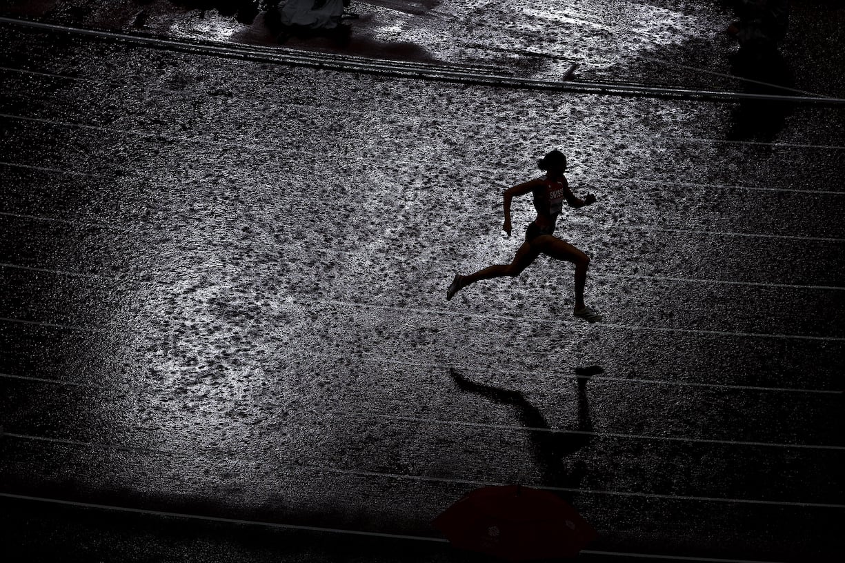 TOKYO, JAPAN - AUGUST 02: Lea Sprunger of Team Switzerland competes in the rain during the women's 400 metres semifinal on day ten of the Tokyo 2020 Olympic Games at Olympic Stadium on August 02, 2021 in Tokyo, Japan. (Photo by Patrick Smith/Getty Images) *** BESTPIX ***