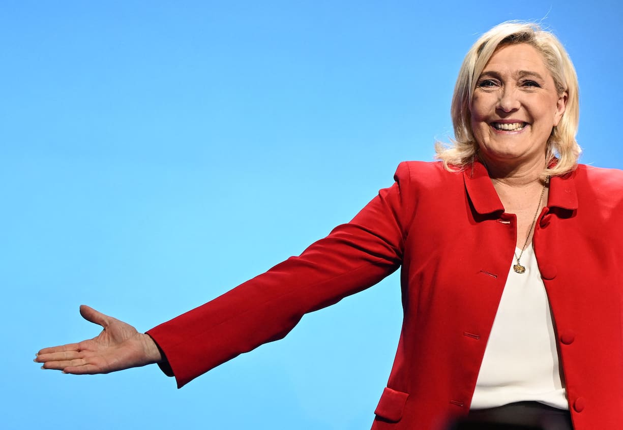 TOPSHOT - French far-right party Rassemblement National (RN) presidential candidate Marine Le Pen arrives on stage to deliver a speech at a gathering with supporters as part of a campaign visit in Avignon on April 14, 2022. (Photo by CHRISTOPHE SIMON / AFP)