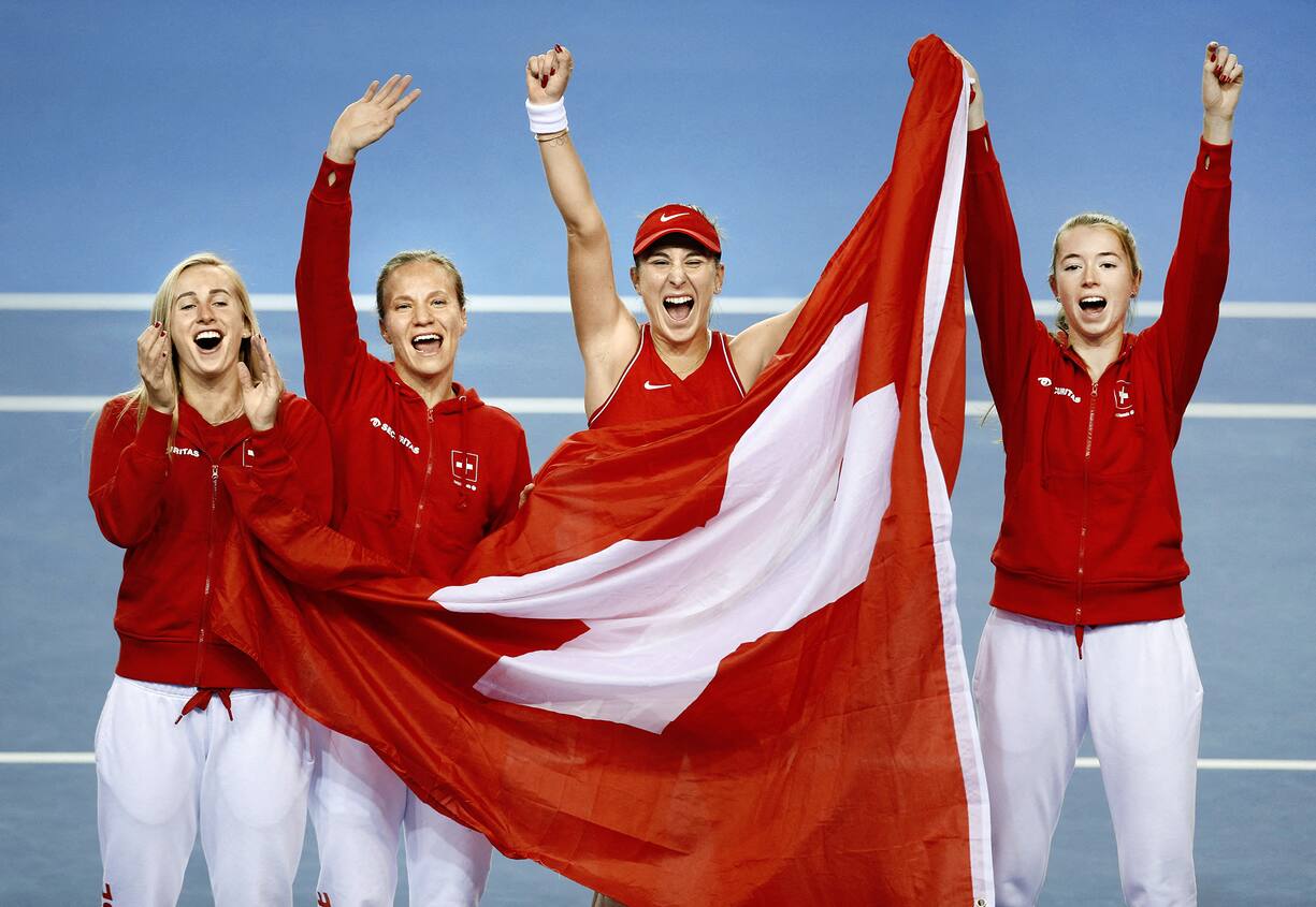 Tennis - Billie Jean King Cup Finals - Emirates Arena, Glasgow, Scotland, Britain - November 13, 2022 Switzerland's Belinda Bencic celebrates with her team after winning her match in the final against Australia's Ajla Tomljanovic REUTERS/Ed Sykes TPX IMAGES OF THE DAY