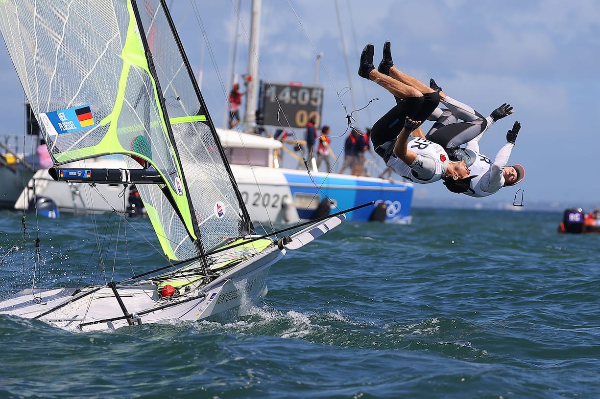 Tokyo 2020 Olympics - Sailing - Men's 49er - Medal Race - Enoshima Yacht Harbour - Tokyo, Japan - August 3, 2021. Erik Heil of Germany and Thomas Ploessel of Germany jump into the water as they celebrate winning bronze after the race. REUTERS/Carlos Barria    SEARCH "OLYMPICS DAY 12" FOR TOKYO 2020 OLYMPICS EDITOR'S CHOICE, SEARCH "REUTERS OLYMPICS TOPIX" FOR ALL EDITOR'S CHOICE PICTURES.TPX IMAGES OF THE DAY.