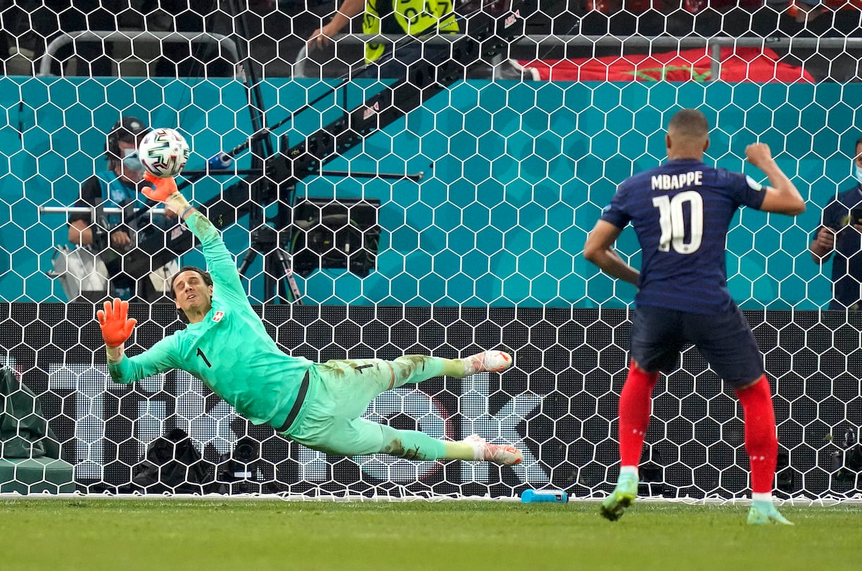 Switzerland's goalkeeper Yann Sommer saves the penalty shot by France's Kylian Mbappe during the Euro 2020 soccer championship round of 16 match between France and Switzerland at the National Arena stadium in Bucharest, Romania, Tuesday, June 29, 2021. (AP Photo/Vadim Ghirda, Pool)