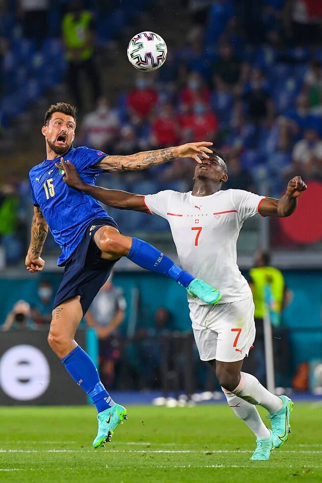 ROME, ITALY - JUNE 16: Francesco Acerbi of Italy battles for a header with Breel Embolo of Switzerland during the UEFA Euro 2020 Championship Group A match between Italy and Switzerland at Olimpico Stadium on June 16, 2021 in Rome, Italy. (Photo by Alberto Lingria - Pool/Getty Images)