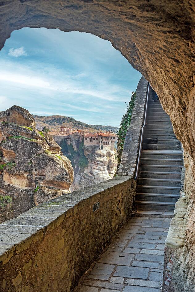 Stairs leading to great meteoro and varlaam monastery as a background , an unesco world heritage site, located on a unique rock formation above the village of Kalambaka.