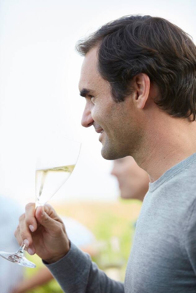 Roger Federer toasting in the vineyards