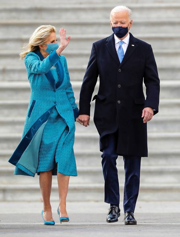 U.S. first lady Jill Biden waves next to President Joe Biden as they leave the U.S. Capitol after the inauguration ceremony, in Washington, U.S., January 20, 2021. REUTERS/Mike Segar