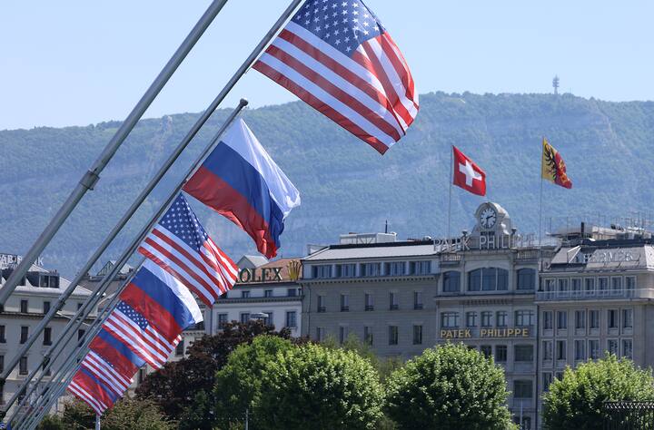 GENEVA, SWITZERLAND - JUNE 15: A Swiss flag flies behind Russian and American flags in the city center prior to a meeting between U.S. President Joe Biden and Russian President Vladimir Putin on June 15, 2021 in Geneva, Switzerland. Biden and Putin are to meet in Geneva for a one-day summit at the nearby Villa La Grange tomorrow. (Photo by Sean Gallup/Getty Images)