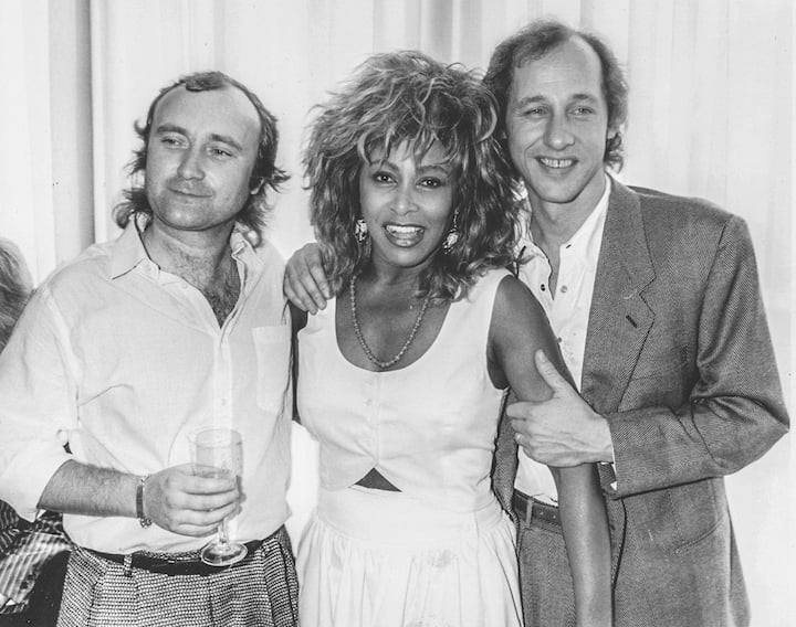 Les musiciens Phil Collins, Tina Turner et Mark Knopfler lors d'un événement en l'honneur de la princesse Michael de Kent, en Angleterre, le 8 juillet 1986.