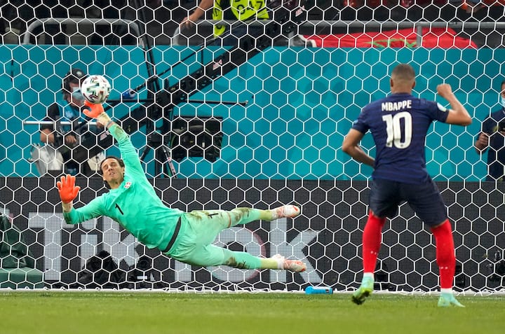 Switzerland's goalkeeper Yann Sommer saves the penalty shot by France's Kylian Mbappe during the Euro 2020 soccer championship round of 16 match between France and Switzerland at the National Arena stadium in Bucharest, Romania, Tuesday, June 29, 2021. (AP Photo/Vadim Ghirda, Pool)